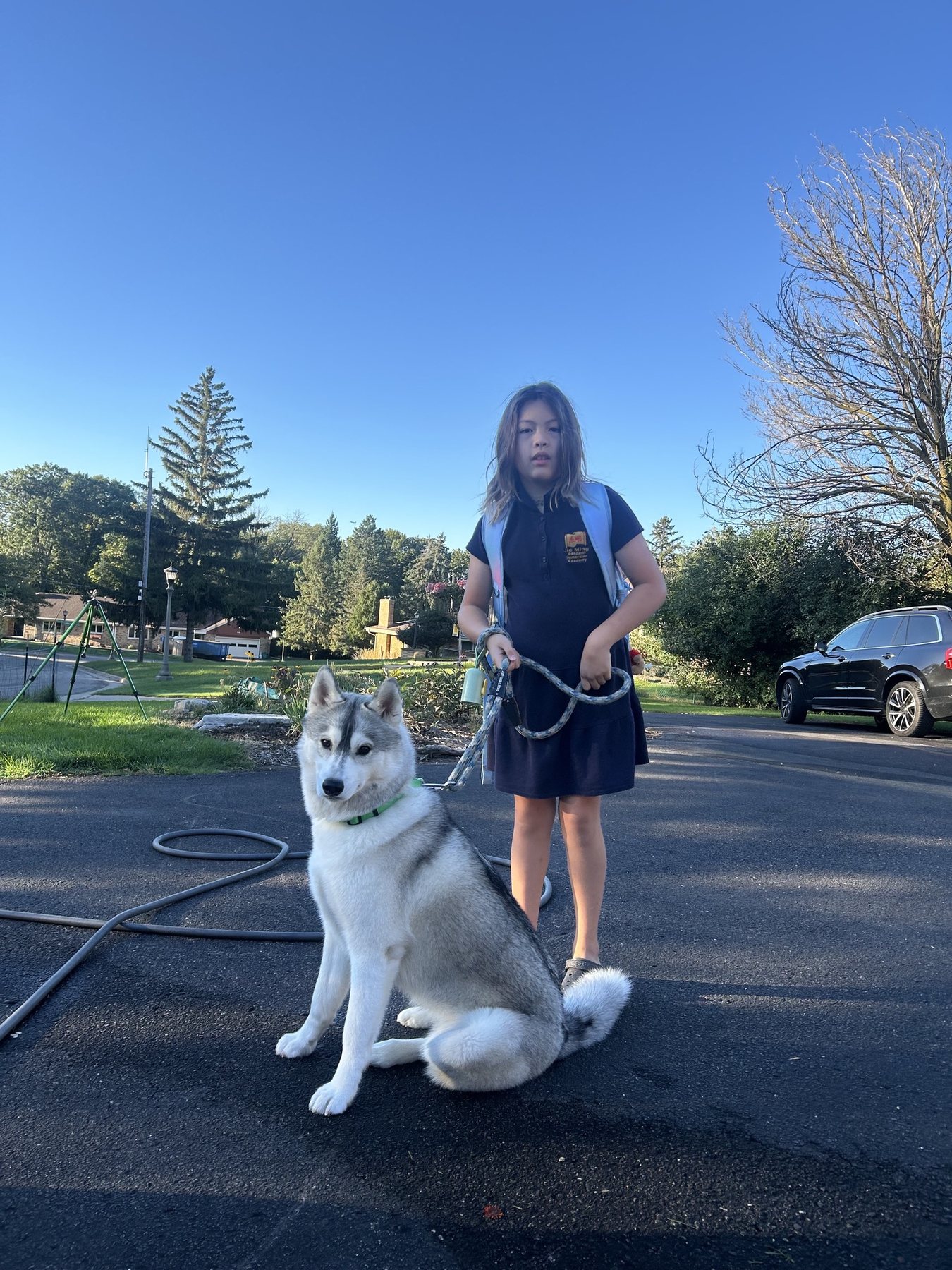 Echo sitting outside with a child